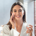 Smiling woman holding a cup, representing brain health, stress relief and immune support.